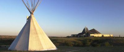 A tipi in a field

Description automatically generated